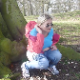 A blonde woman takes a piss at the base of a large tree. Presented in 720P HD video.